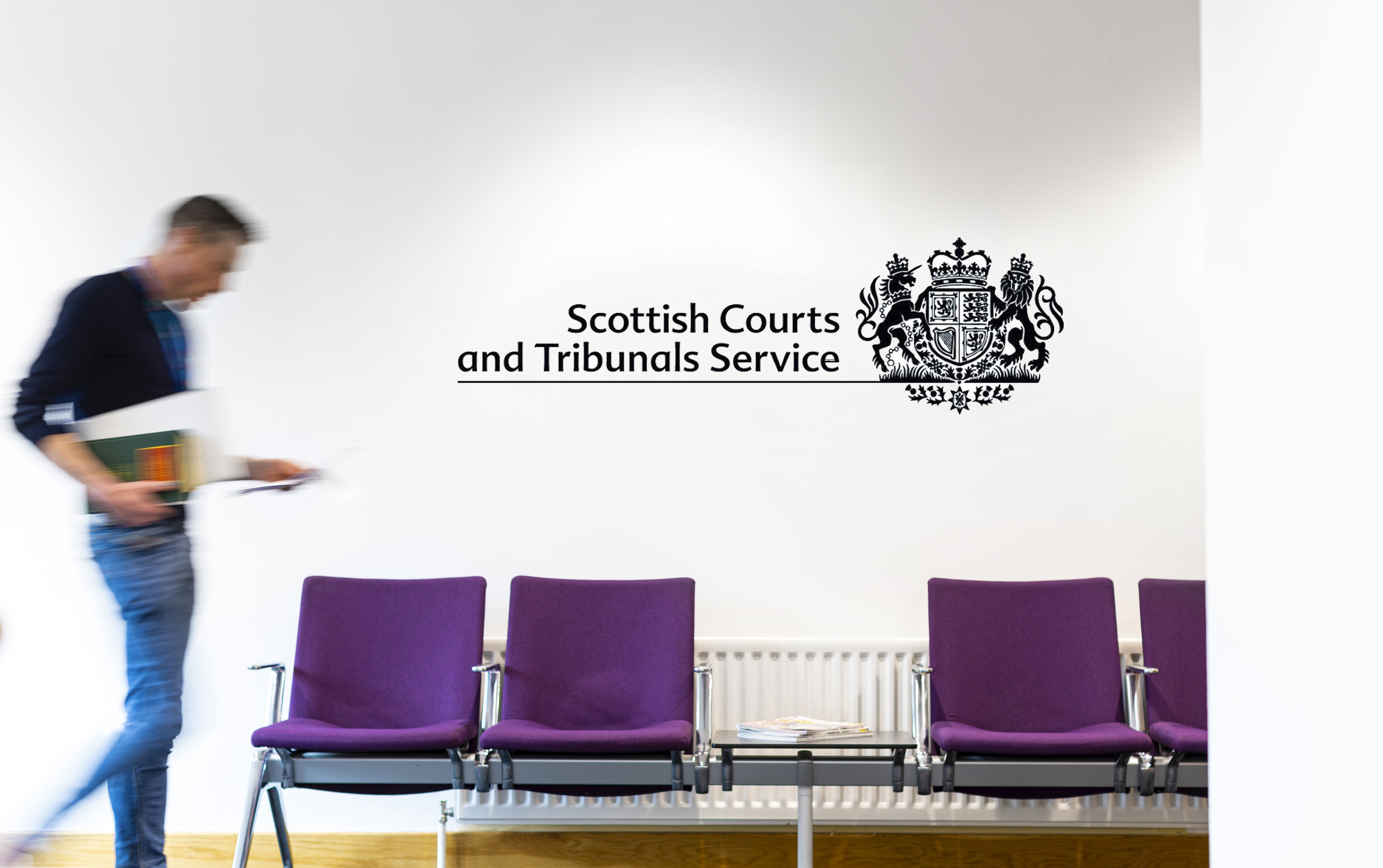 person walking down SCTS corridor