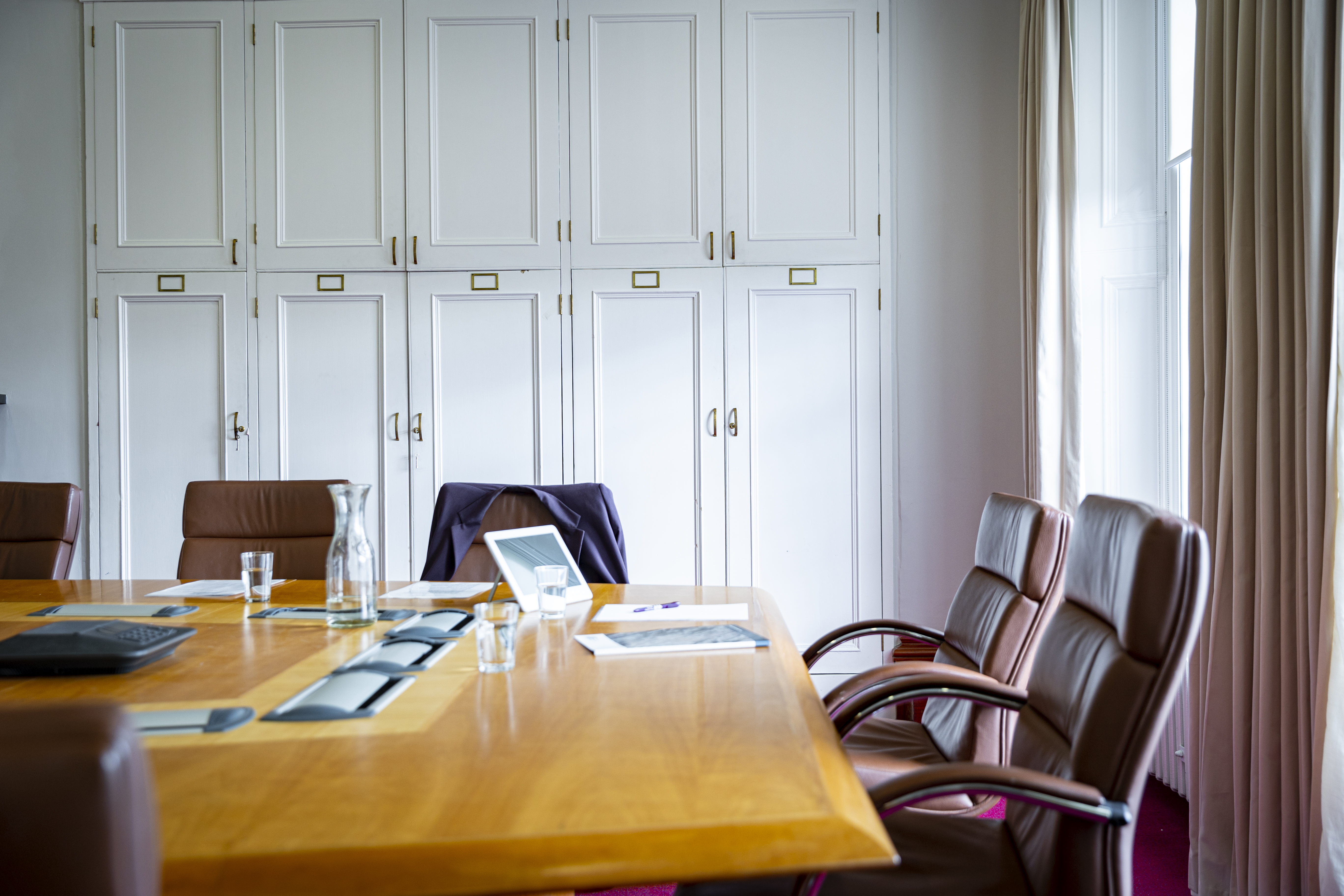 empty conference room table in Parliament House